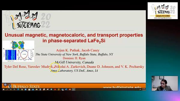 Unusual magnetic, magnetocaloric, and transport properties in phase-separated LaFe2Si